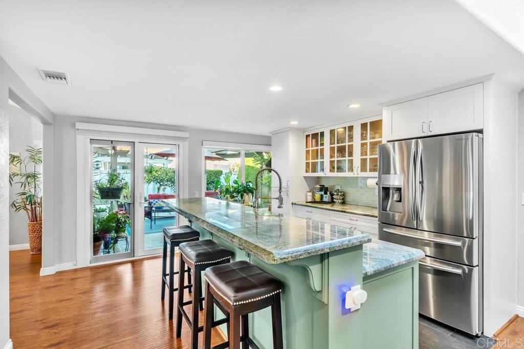 4169 Rhodes Way Oceanside, CA 92056 - Photo 16 of 42 a kitchen with kitchen island a counter top space and stainless steel appliances