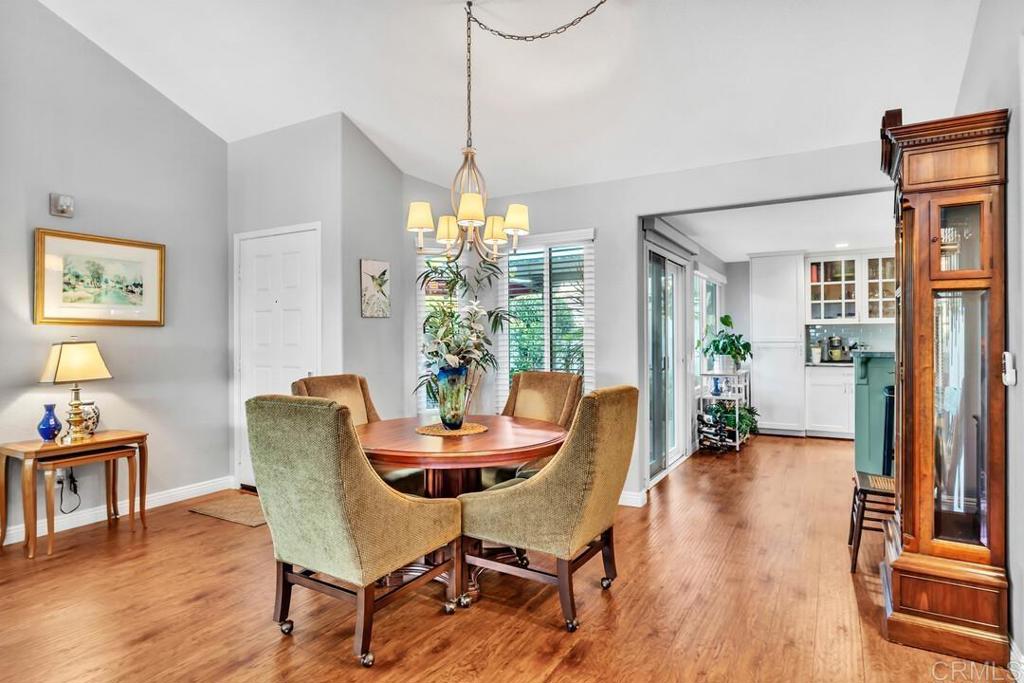 4169 Rhodes Way Oceanside, CA 92056 - Photo 22 of 42 a view of a dining room with furniture window and wooden floor