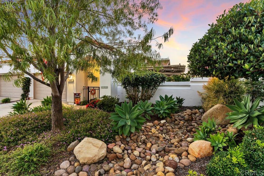 4169 Rhodes Way Oceanside, CA 92056 - Photo 3 of 42 a view of a backyard with plants and outdoor seating