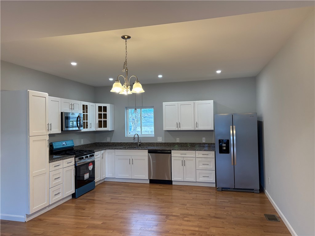 184 Avenue C, Unit M3 Woonsocket, RI 02895 - Photo 3 of 11 Beautiful kitchen featuring granite countertops and stainless steel appliances.
