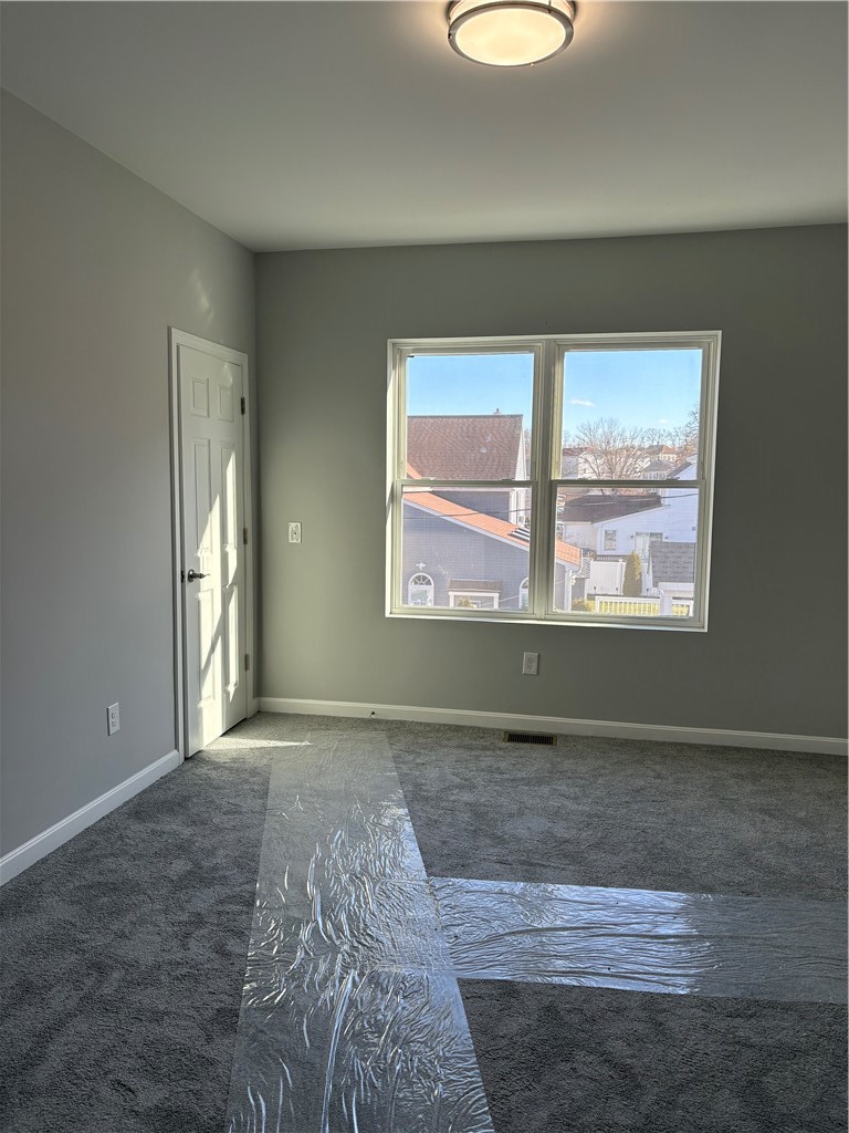 184 Avenue C, Unit M3 Woonsocket, RI 02895 - Photo 4 of 11 Primary suite with a walk-in closet and private bathroom.