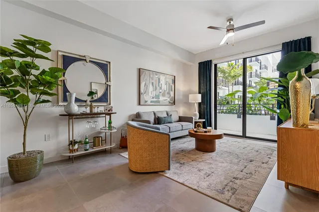 a living room with furniture and a window