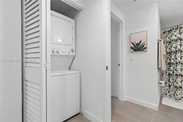 a room that has a rug and a window