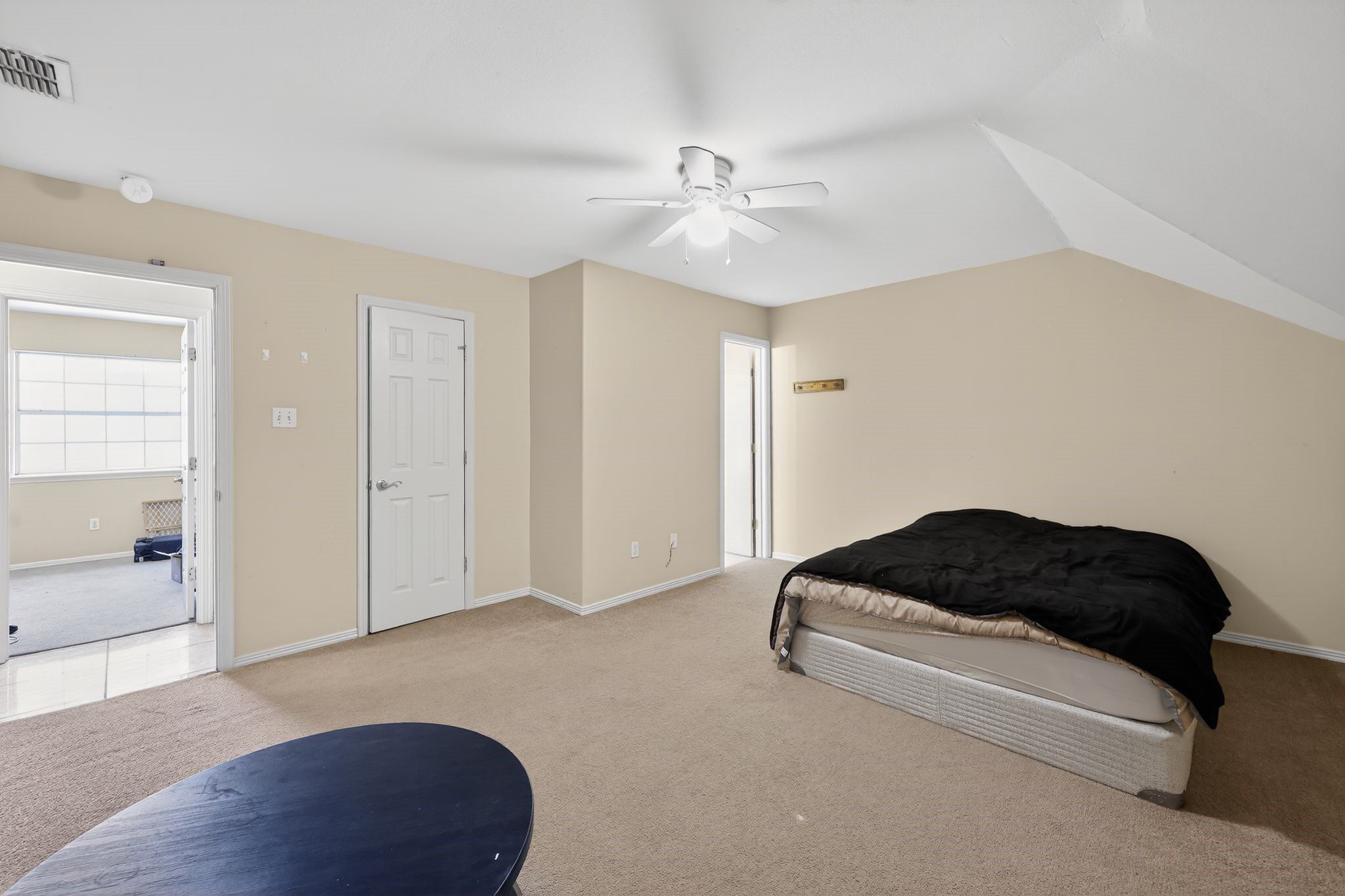 901 Royal Street Edinburg, TX 78539 - Photo 22 of 30 a bedroom with a bed and a chandelier