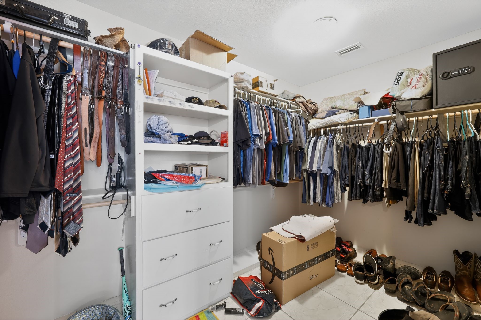 901 Royal Street Edinburg, TX 78539 - Photo 29 of 30 a view of walk in closet with clothes and shoes