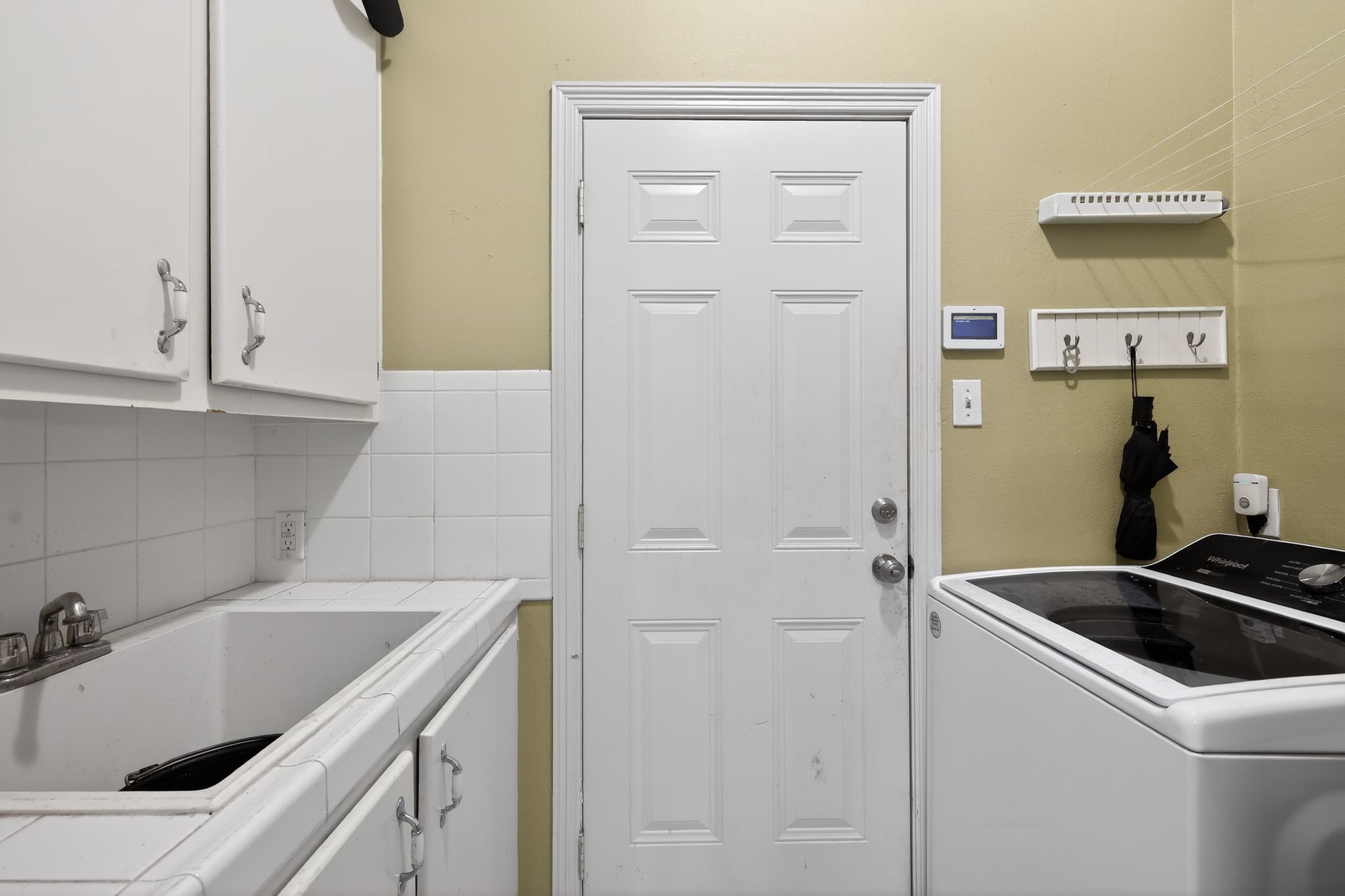 901 Royal Street Edinburg, TX 78539 - Photo 30 of 30 a utility room with sink dryer and washer