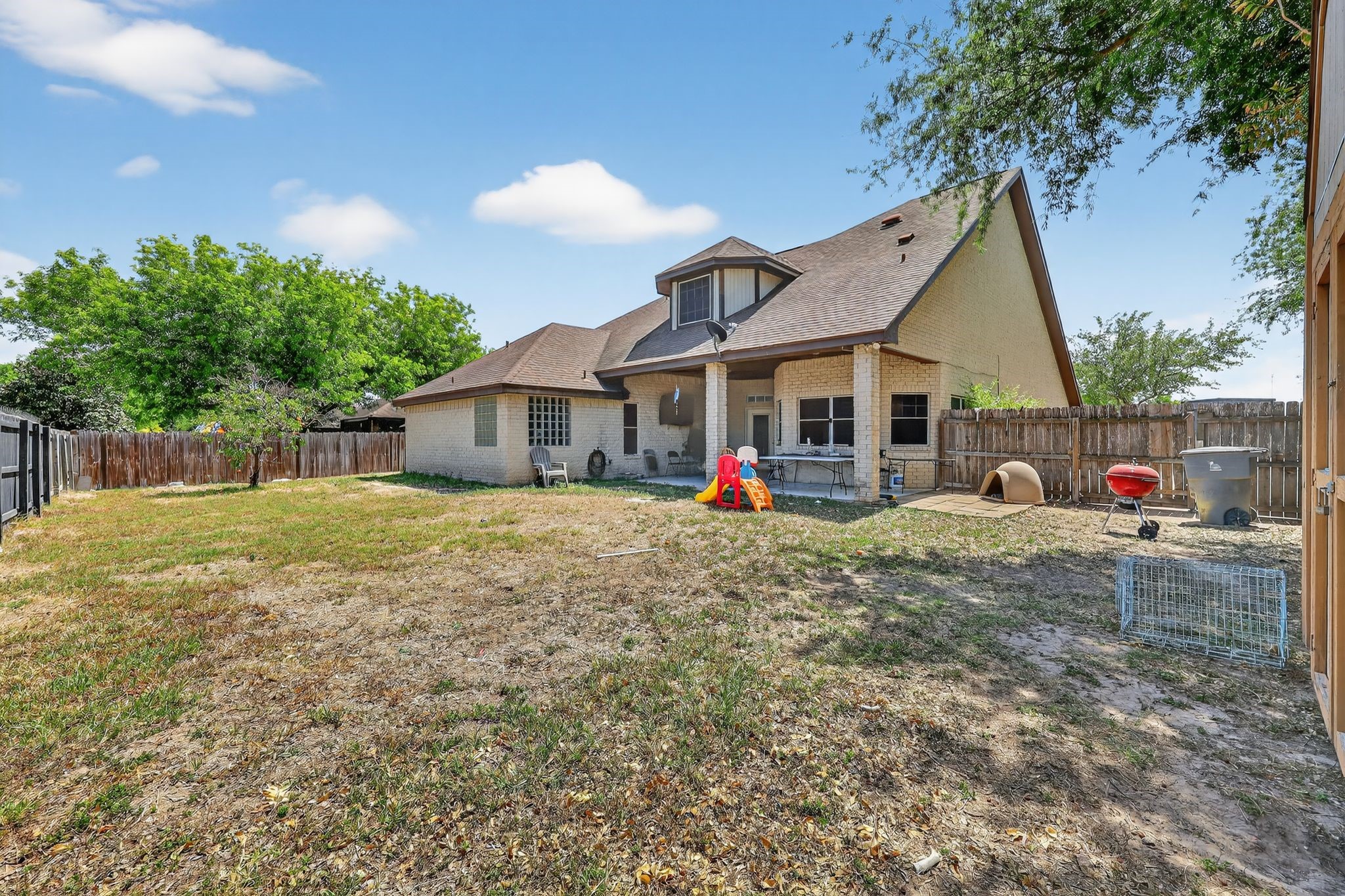 901 Royal Street Edinburg, TX 78539 - Photo 6 of 30 a front view of a house with a garden and tree