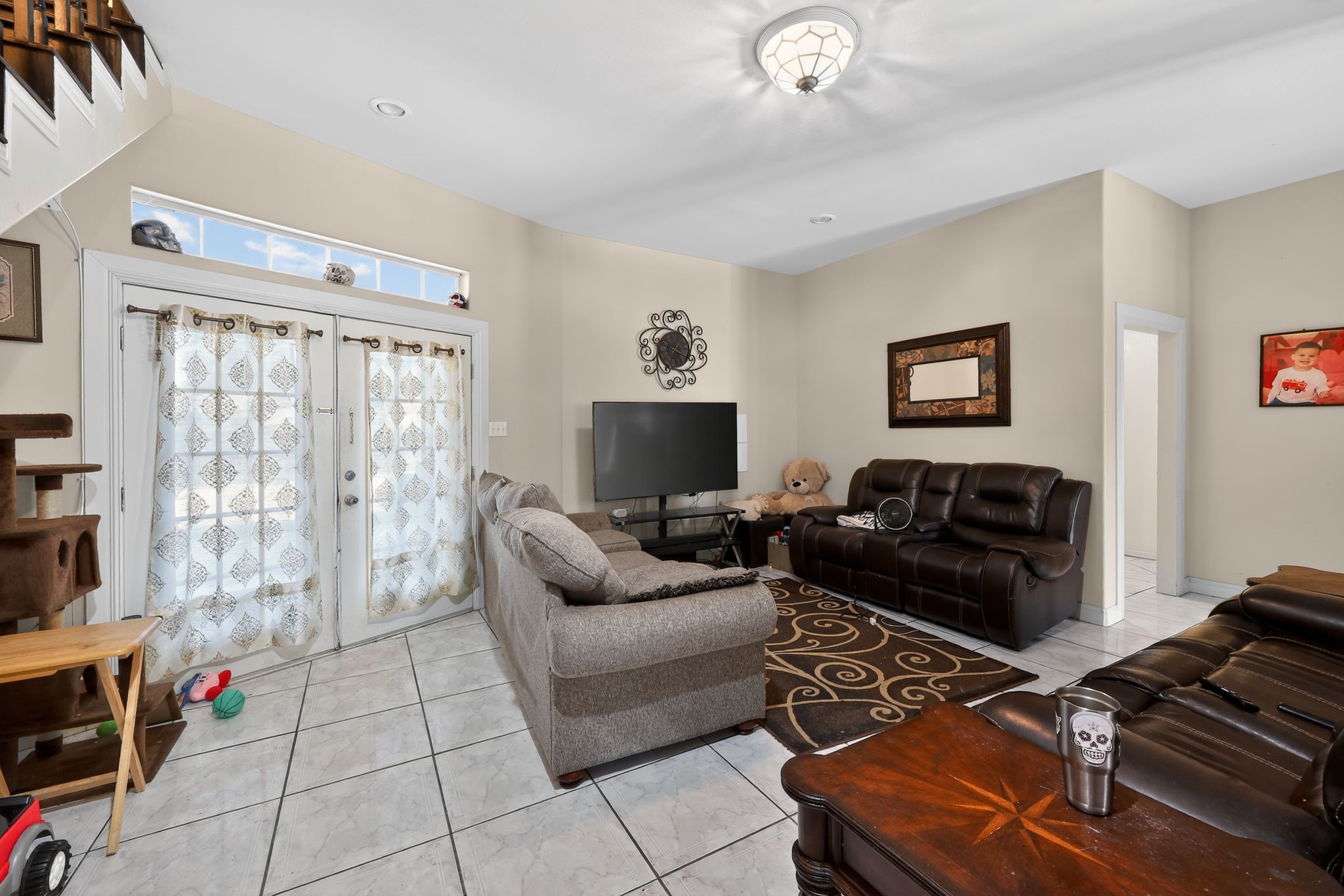 901 Royal Street Edinburg, TX 78539 - Photo 10 of 30 a living room with furniture and a flat screen tv