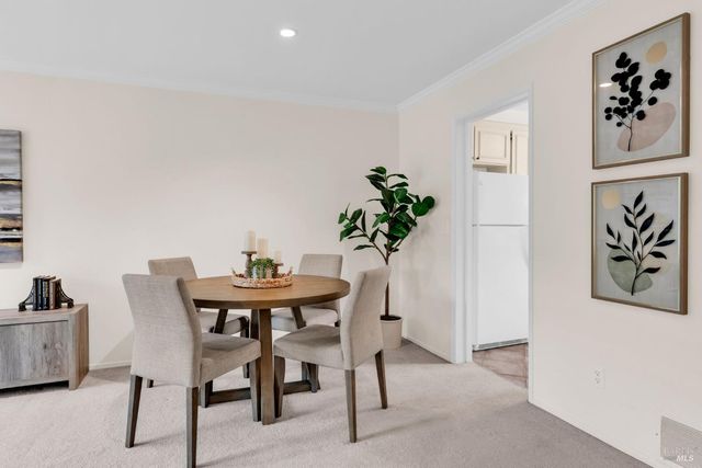 a workspace with furniture and a potted plant