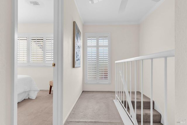 a bedroom with a bed and a mirror