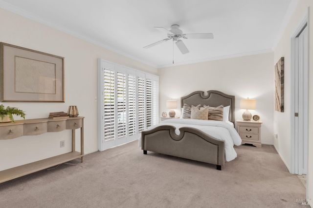 a bedroom with a bed and a table