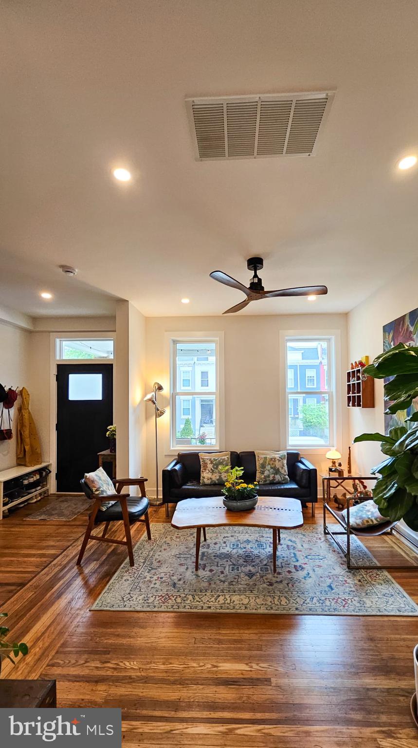 3206 Warder Street Northwest Washington, DC 20010 - Photo 12 of 30 a view of a livingroom with furniture and a floor to ceiling window