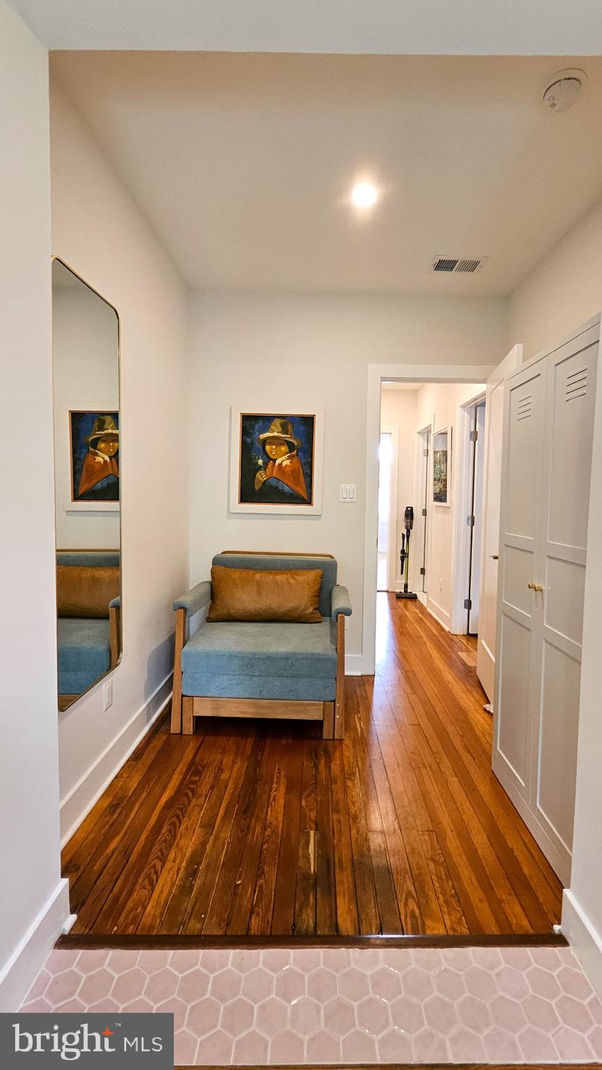 3206 Warder Street Northwest Washington, DC 20010 - Photo 17 of 30 a room with wooden floor and furniture