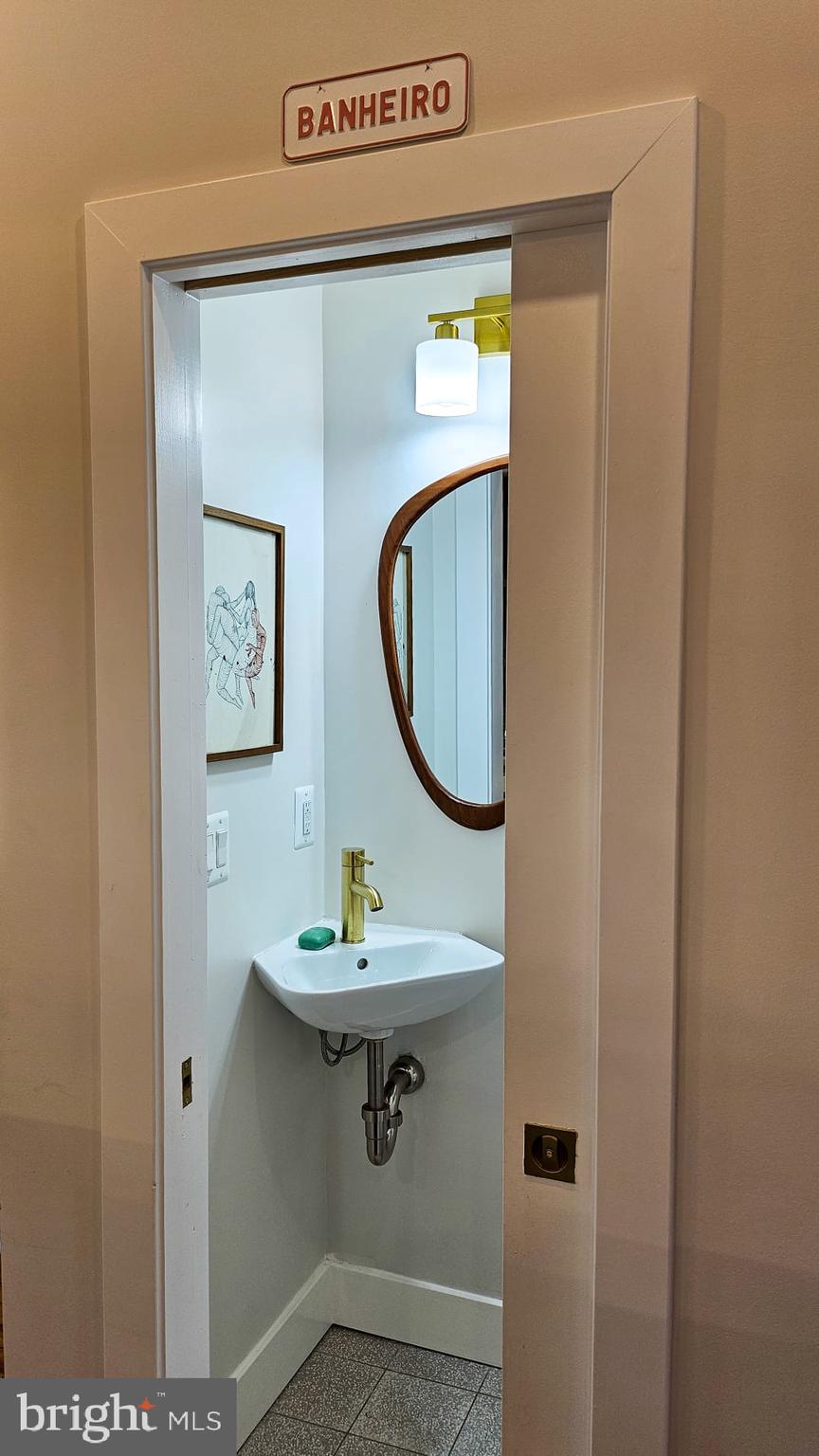 3206 Warder Street Northwest Washington, DC 20010 - Photo 18 of 30 a bathroom with a sink and a mirror