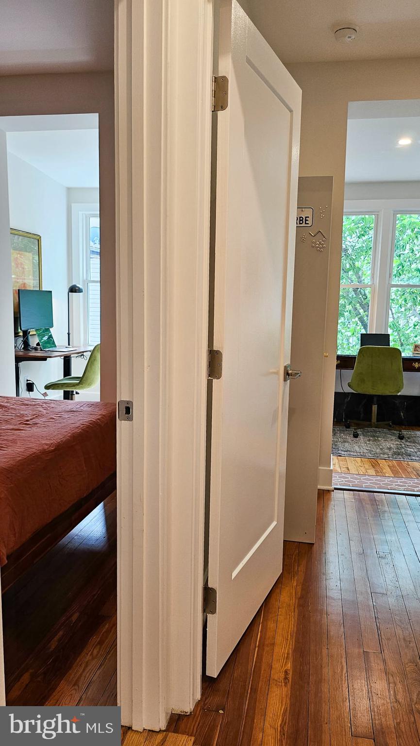 3206 Warder Street Northwest Washington, DC 20010 - Photo 19 of 30 a bedroom with a bed and a mirror on the dresser