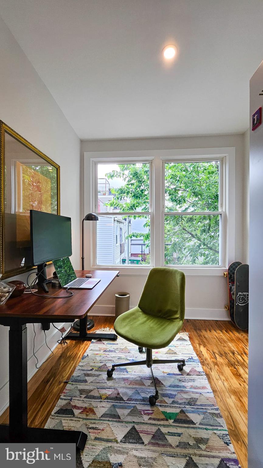 3206 Warder Street Northwest Washington, DC 20010 - Photo 21 of 30 a workspace with furniture and a flat screen tv