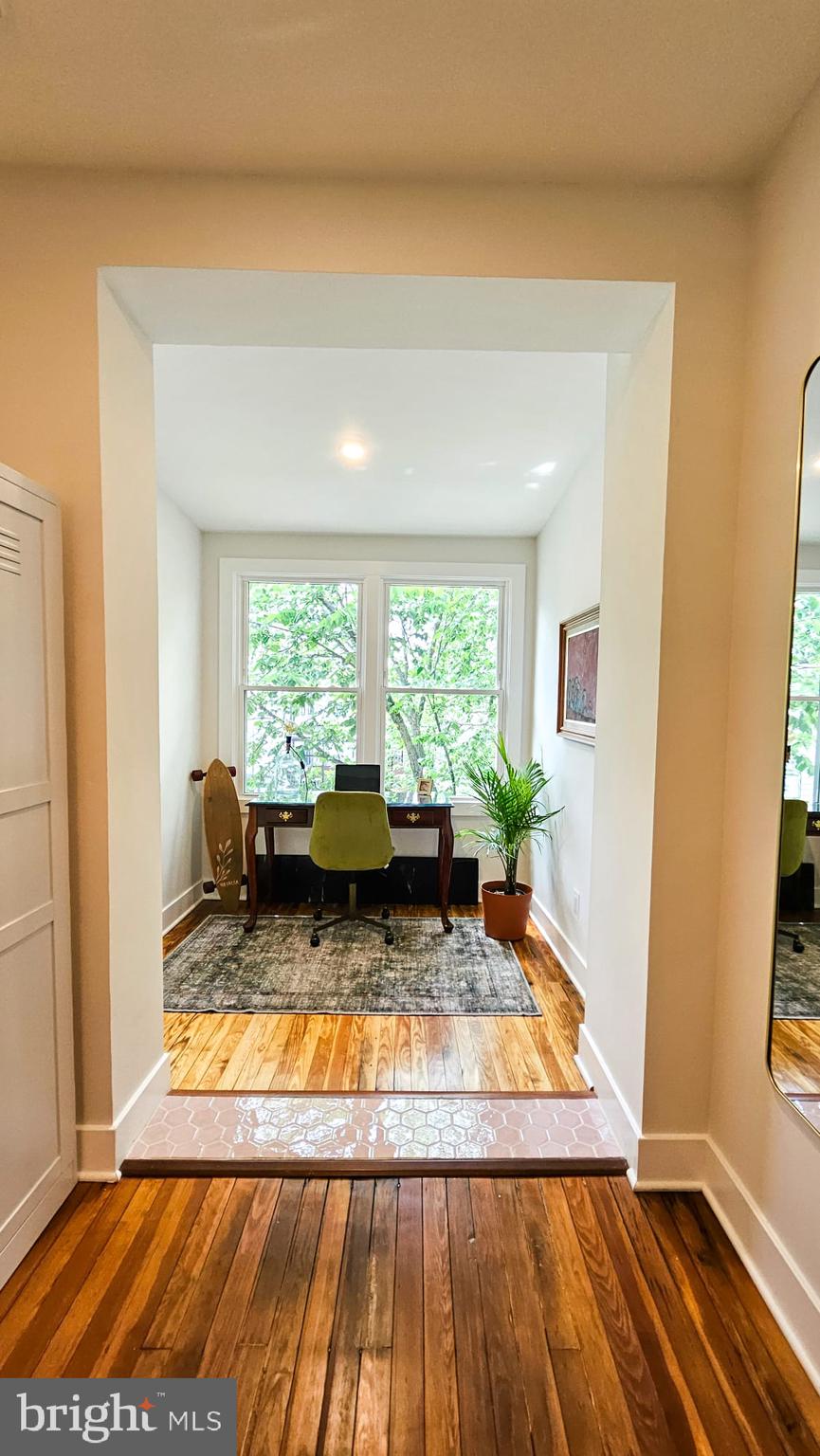 3206 Warder Street Northwest Washington, DC 20010 - Photo 25 of 30 a view of a living room with a rug floor and a floor to ceiling window
