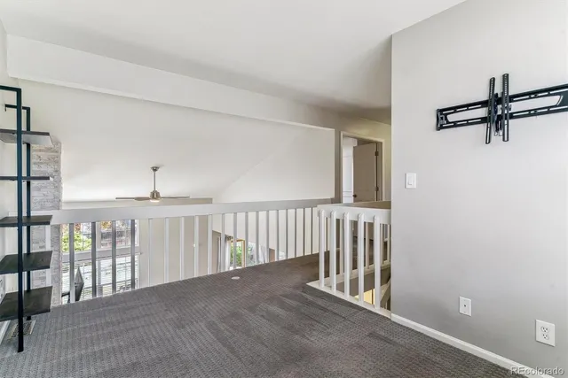 a view of a hallway with windows