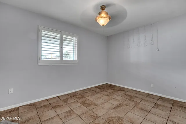 an empty room that has a window in it