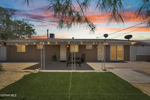 an aerial view of residential houses with city view