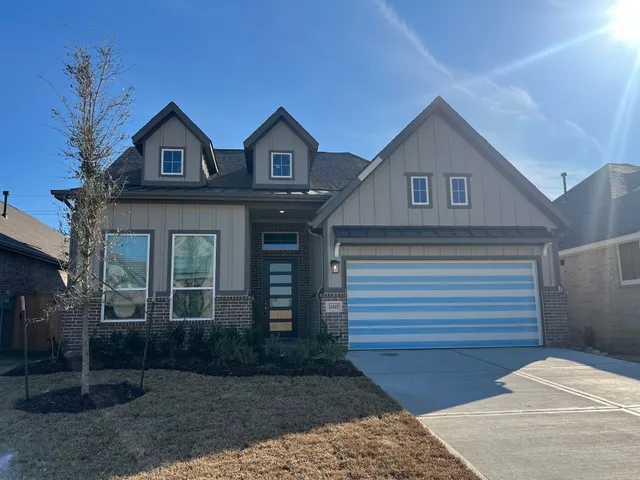 a view of a brick house with many windows