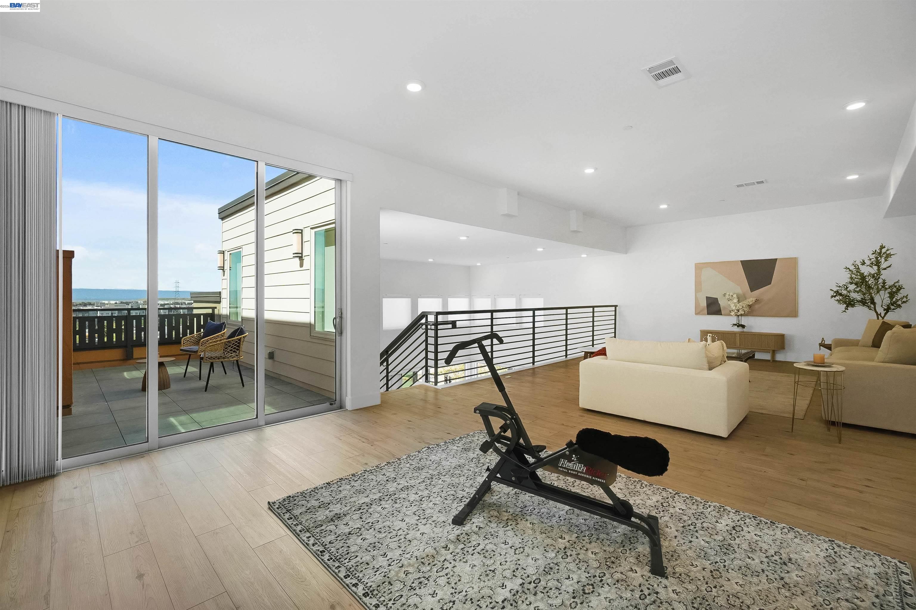 2250 Kilowatt Way, Unit 402 Fremont, CA 94539 - Photo 13 of 51 a living room with furniture and wooden floor