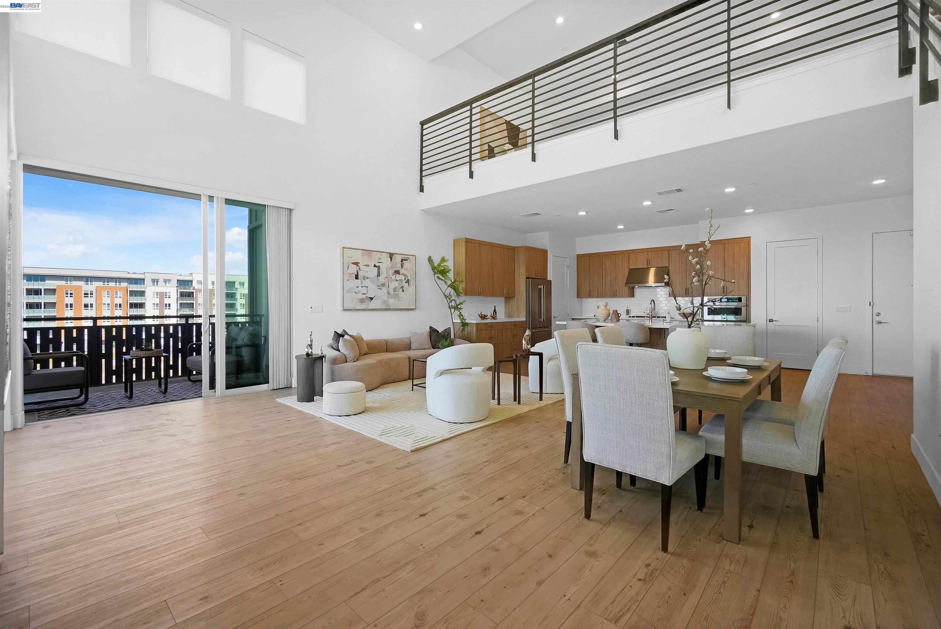 2250 Kilowatt Way, Unit 402 Fremont, CA 94539 - Photo 17 of 51 a living room with furniture a wooden floor and a view of kitchen