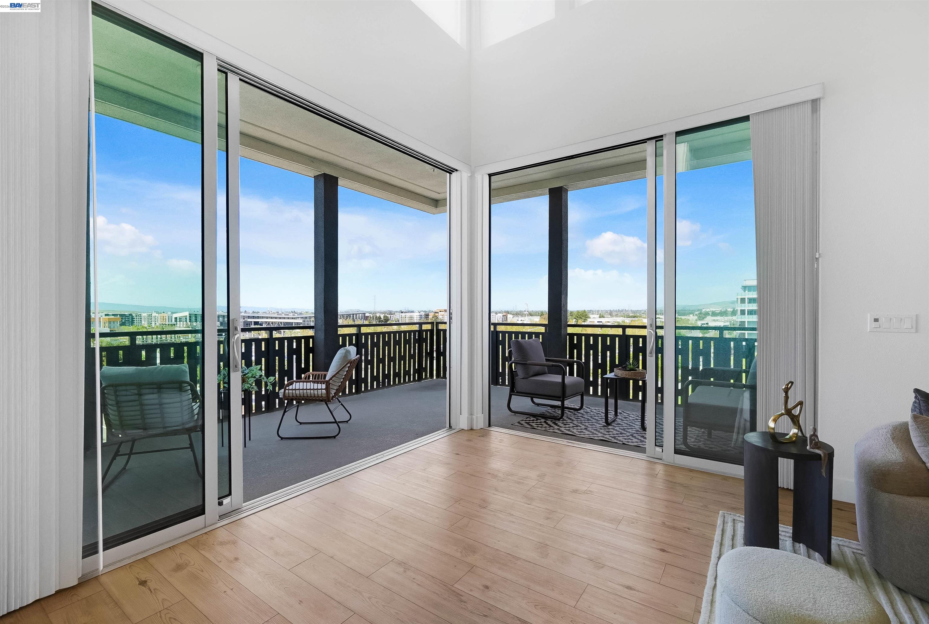 2250 Kilowatt Way, Unit 402 Fremont, CA 94539 - Photo 21 of 51 wooden floor with furniture and floor to ceiling window