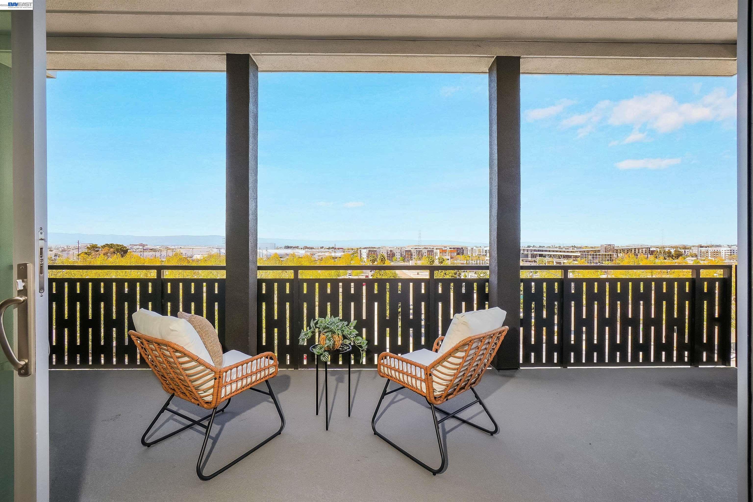 2250 Kilowatt Way, Unit 402 Fremont, CA 94539 - Photo 25 of 51 a balcony with couple of chairs and a couch
