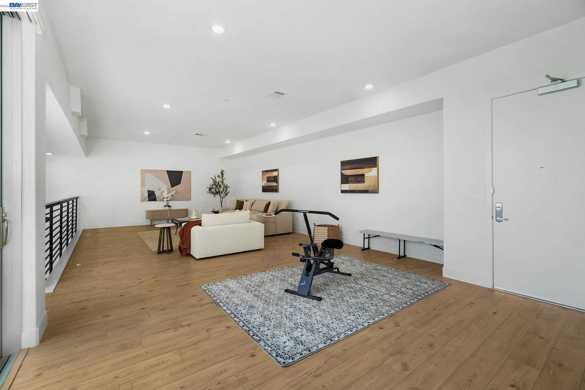 2250 Kilowatt Way, Unit 402 Fremont, CA 94539 - Photo 26 of 51 a living room with furniture and a rug