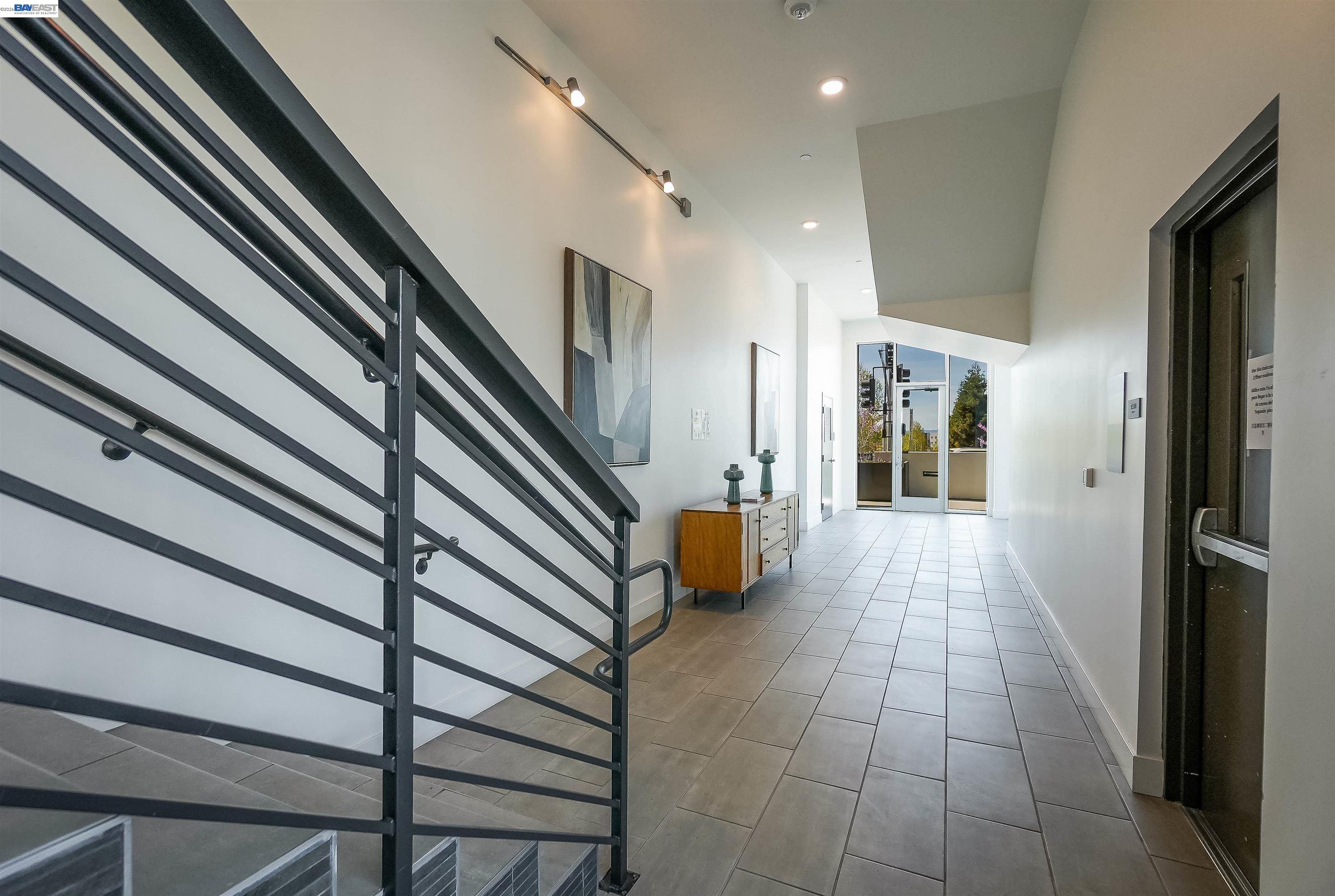 2250 Kilowatt Way, Unit 402 Fremont, CA 94539 - Photo 36 of 51 a hallway with a white walls and stairs