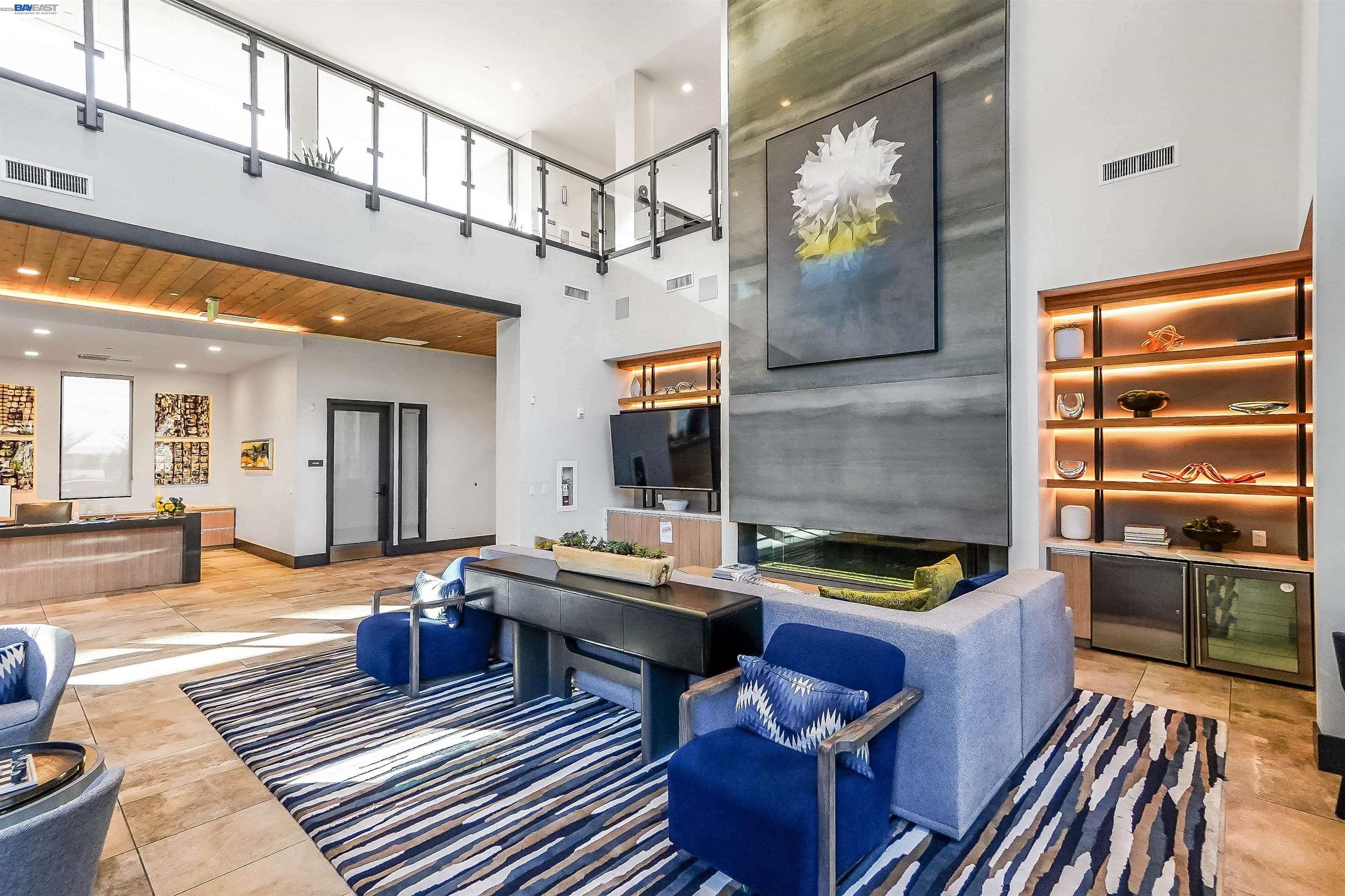 2250 Kilowatt Way, Unit 402 Fremont, CA 94539 - Photo 4 of 51 a living room with furniture rug and wooden floor
