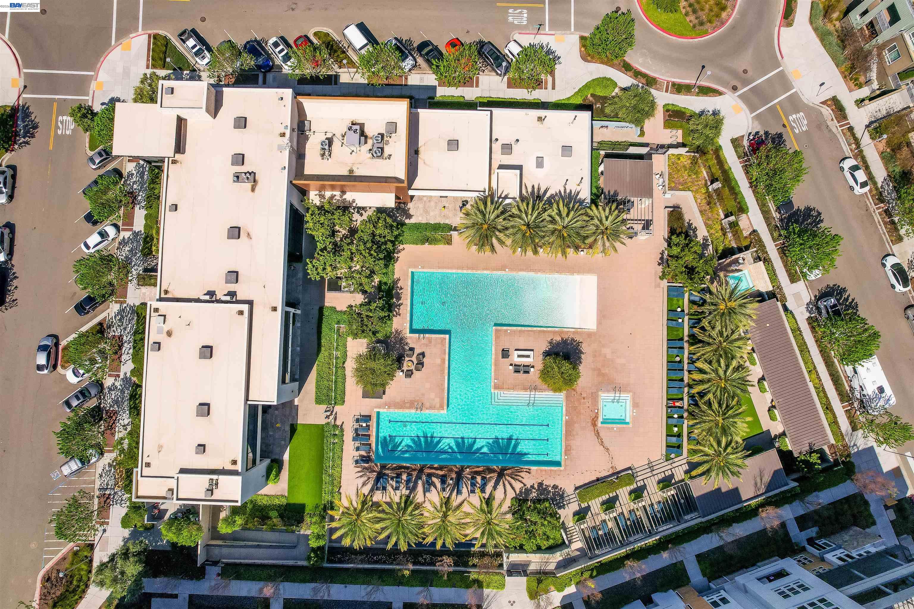 2250 Kilowatt Way, Unit 402 Fremont, CA 94539 - Photo 41 of 51 an aerial view of a house with a yard and large trees
