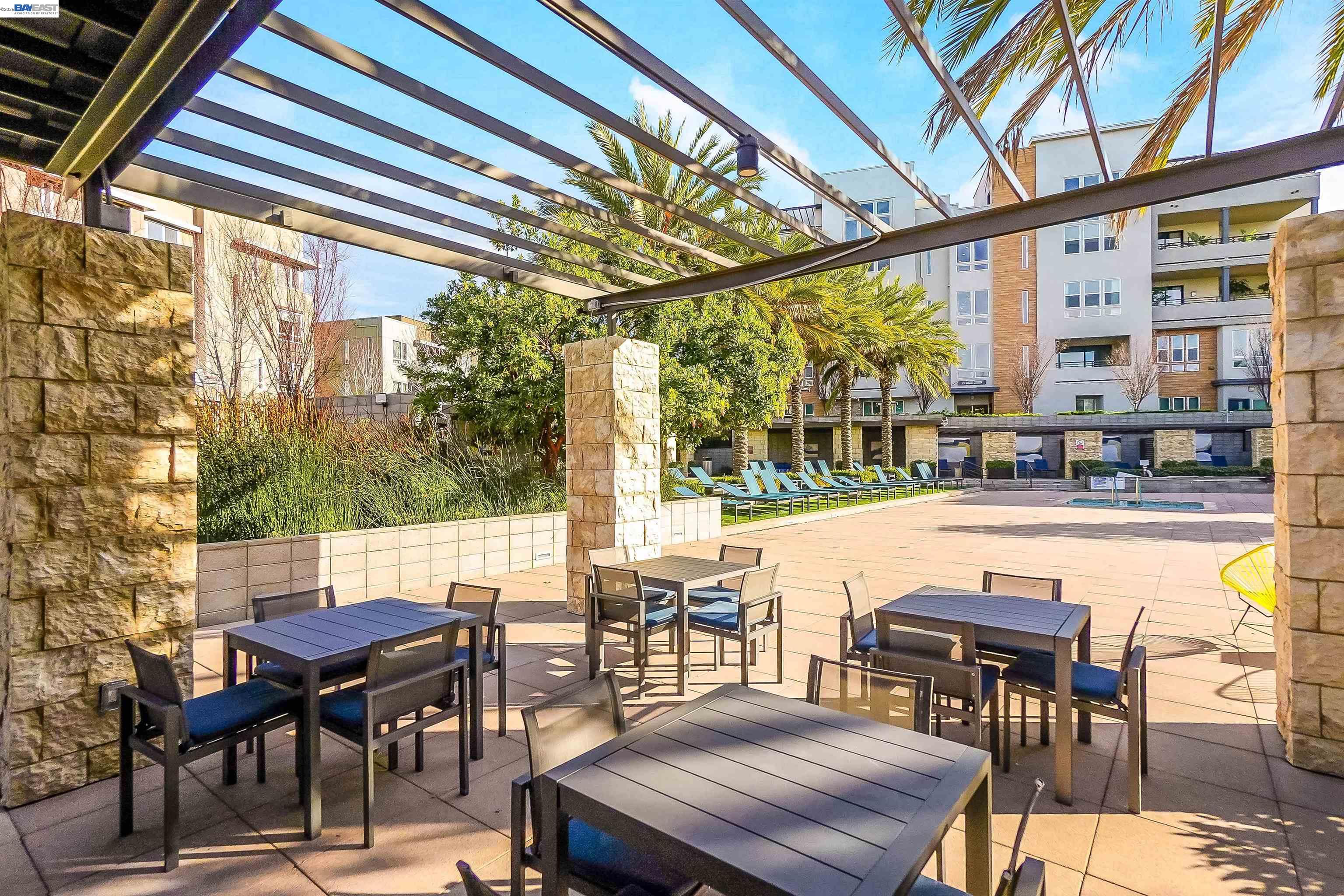 2250 Kilowatt Way, Unit 402 Fremont, CA 94539 - Photo 51 of 51 a view of a patio with table and chairs and couches
