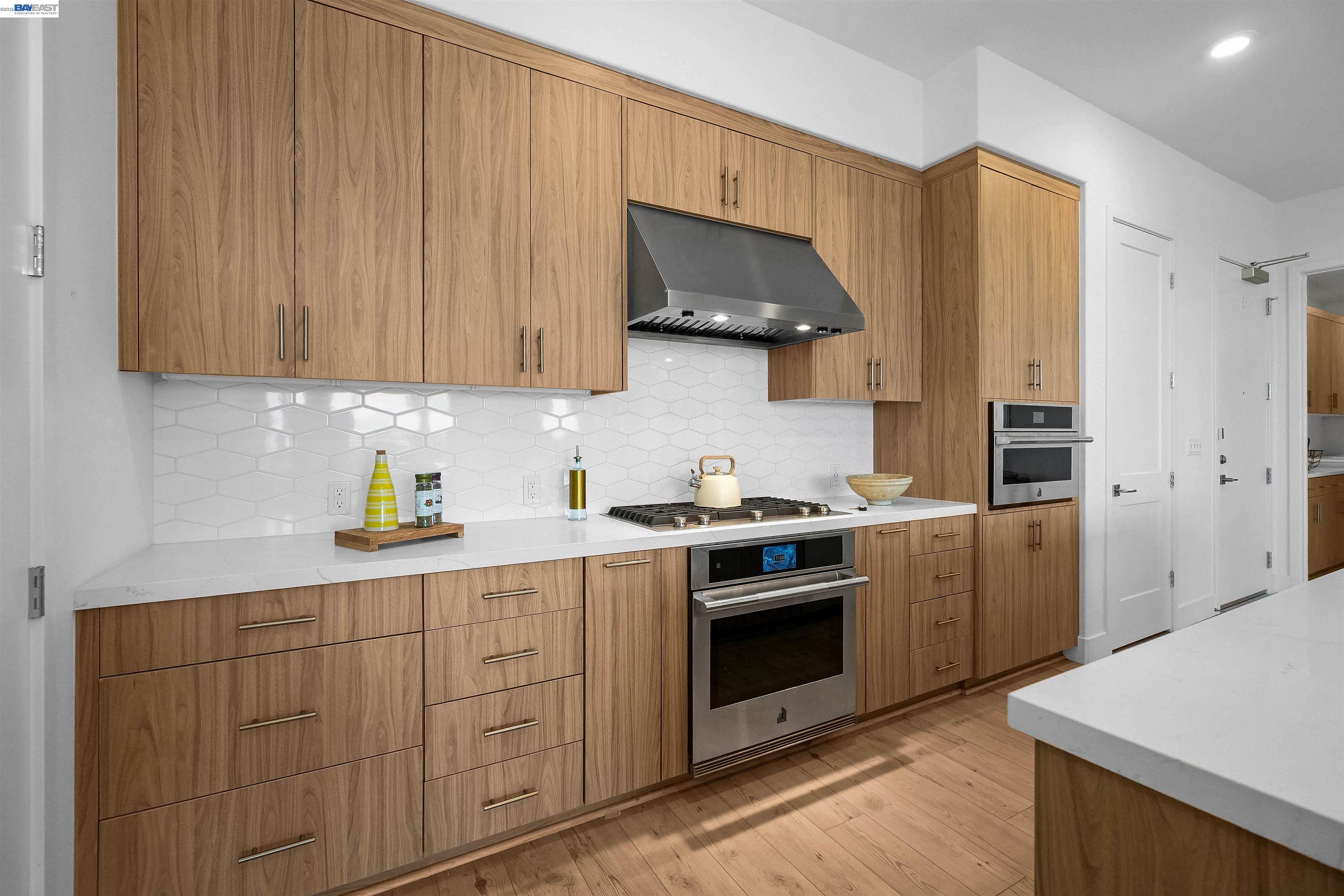 2250 Kilowatt Way, Unit 402 Fremont, CA 94539 - Photo 8 of 51 a kitchen with stainless steel appliances a stove a sink and a refrigerator
