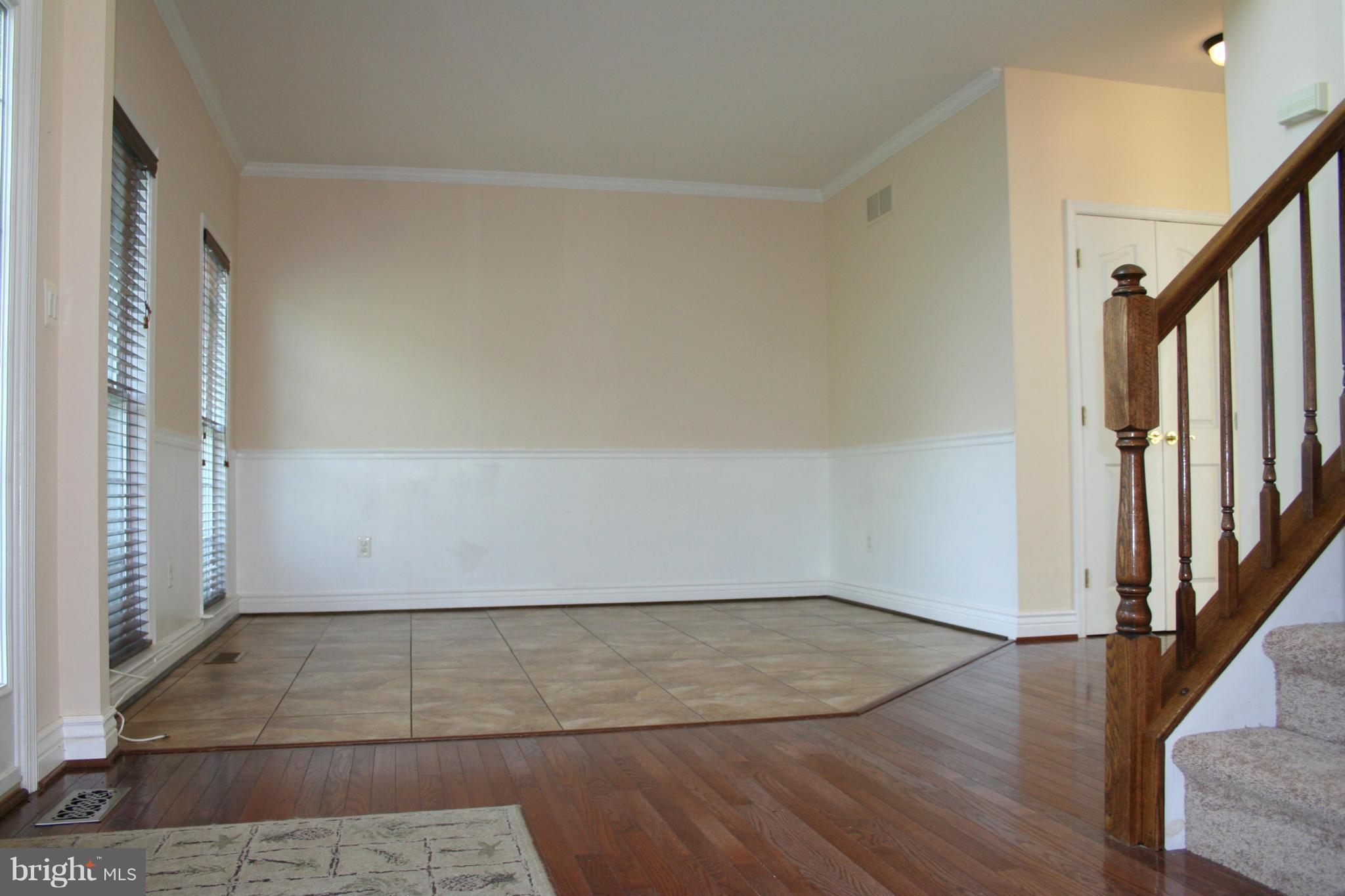 307 Ailsa Drive Rising Sun, MD 21911 - Photo 5 of 30 an empty room with wooden floor and staircase