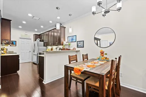 a kitchen with granite countertop stainless steel appliances a refrigerator and a sink