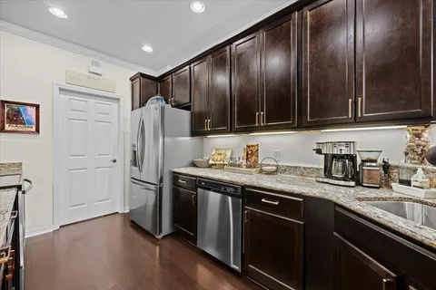 a kitchen with stainless steel appliances and sink