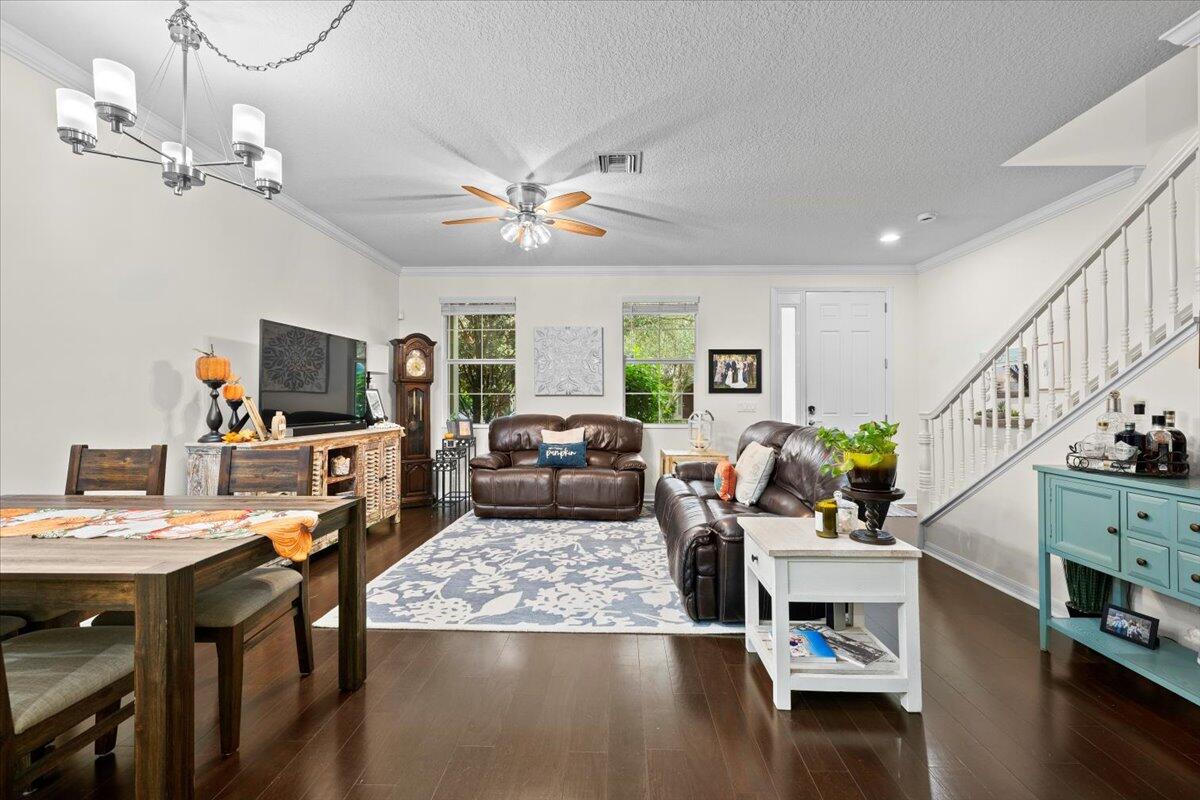 1108 South Community Drive Jupiter, FL 33458 - Photo 3 of 38 a living room with furniture and a flat screen tv