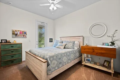 a bed room with a bed window and a chair