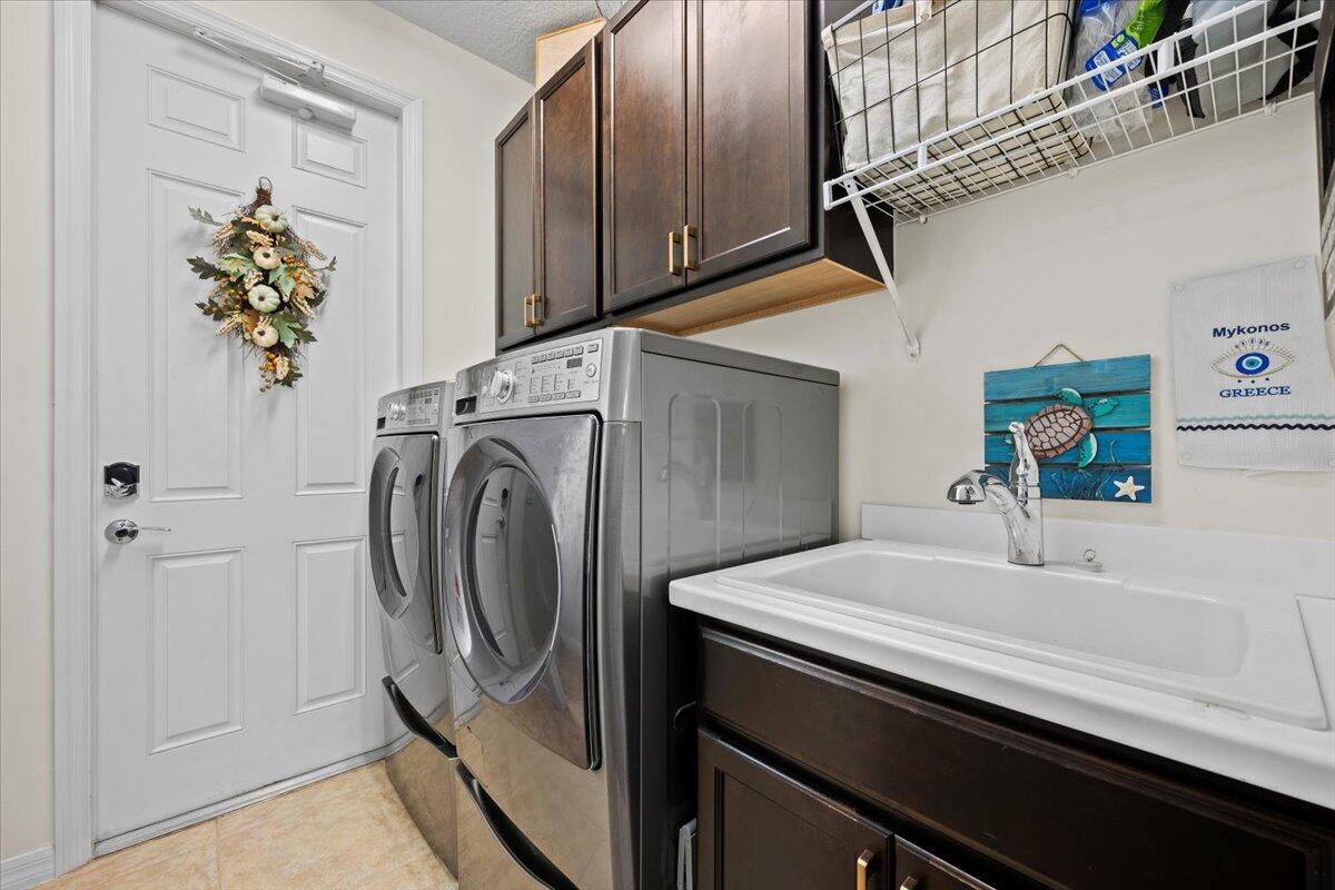 1108 South Community Drive Jupiter, FL 33458 - Photo 10 of 38 a utility room with dryer and washer