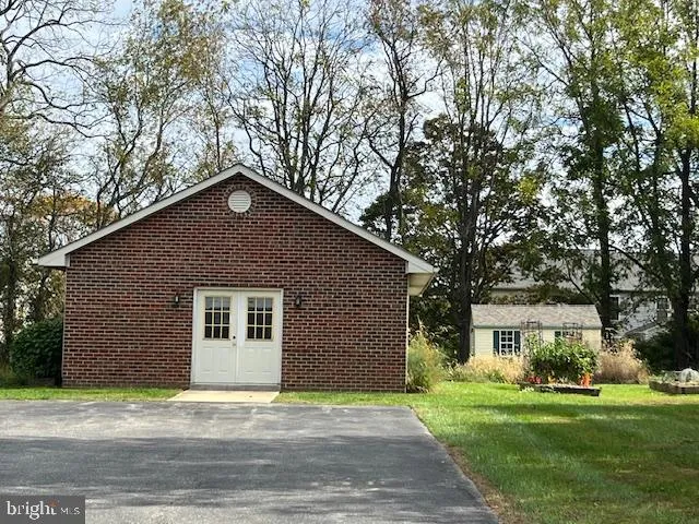 a house that has a tree in front of it