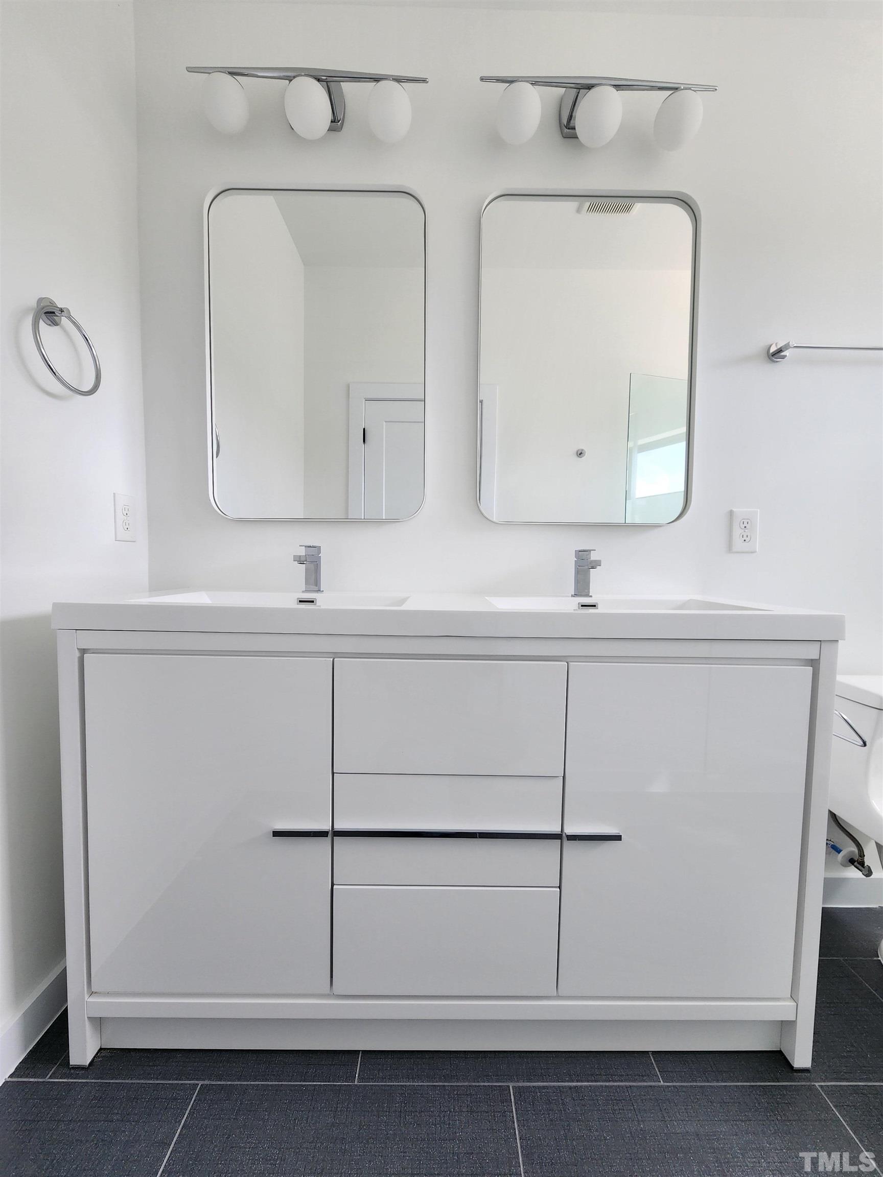 1203 East Lane Street Raleigh, NC 27601 - Photo 13 of 24 a bathroom with a sink vanity and mirror