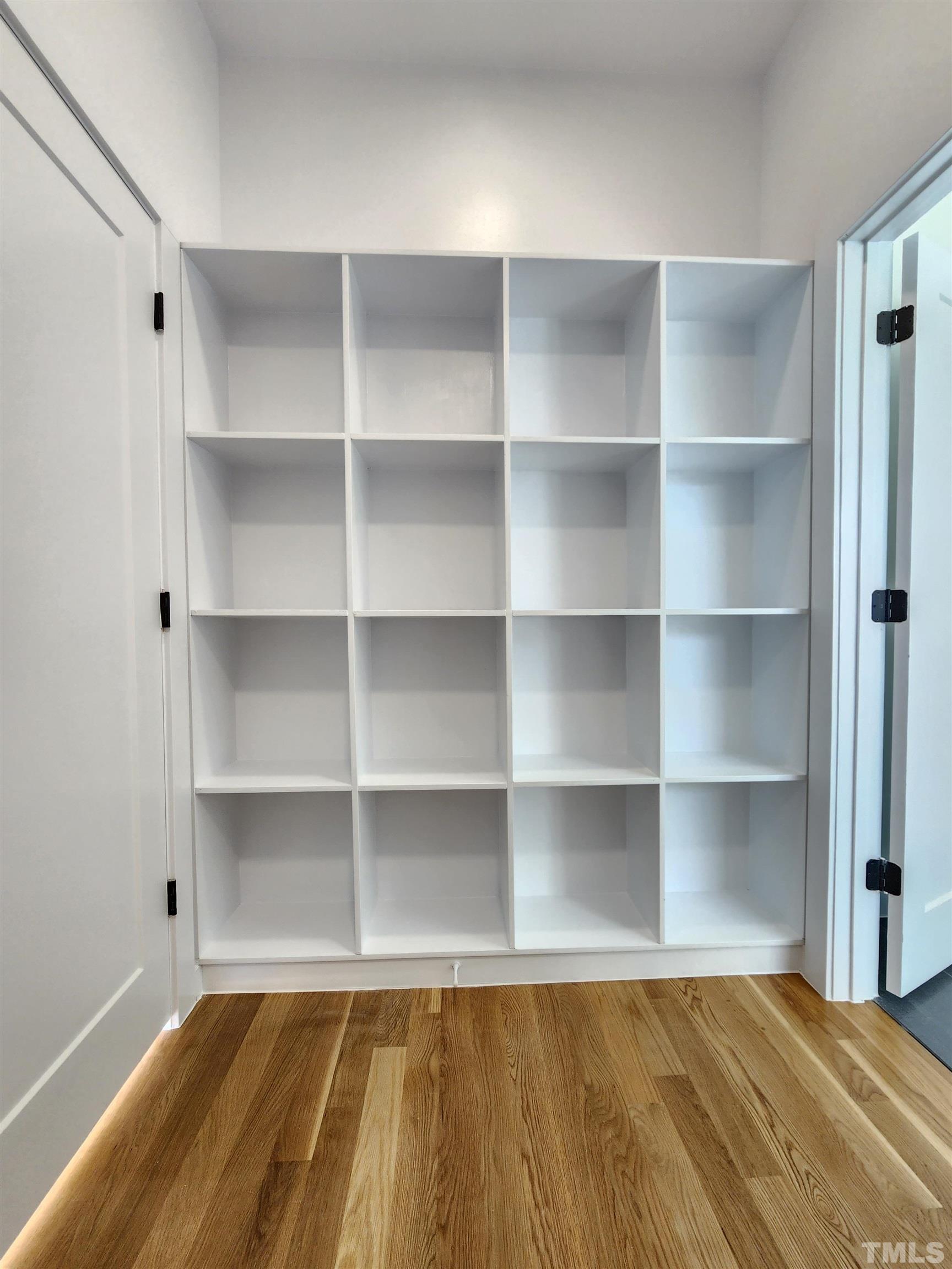 1203 East Lane Street Raleigh, NC 27601 - Photo 15 of 24 a room with walk in closet with empty racks