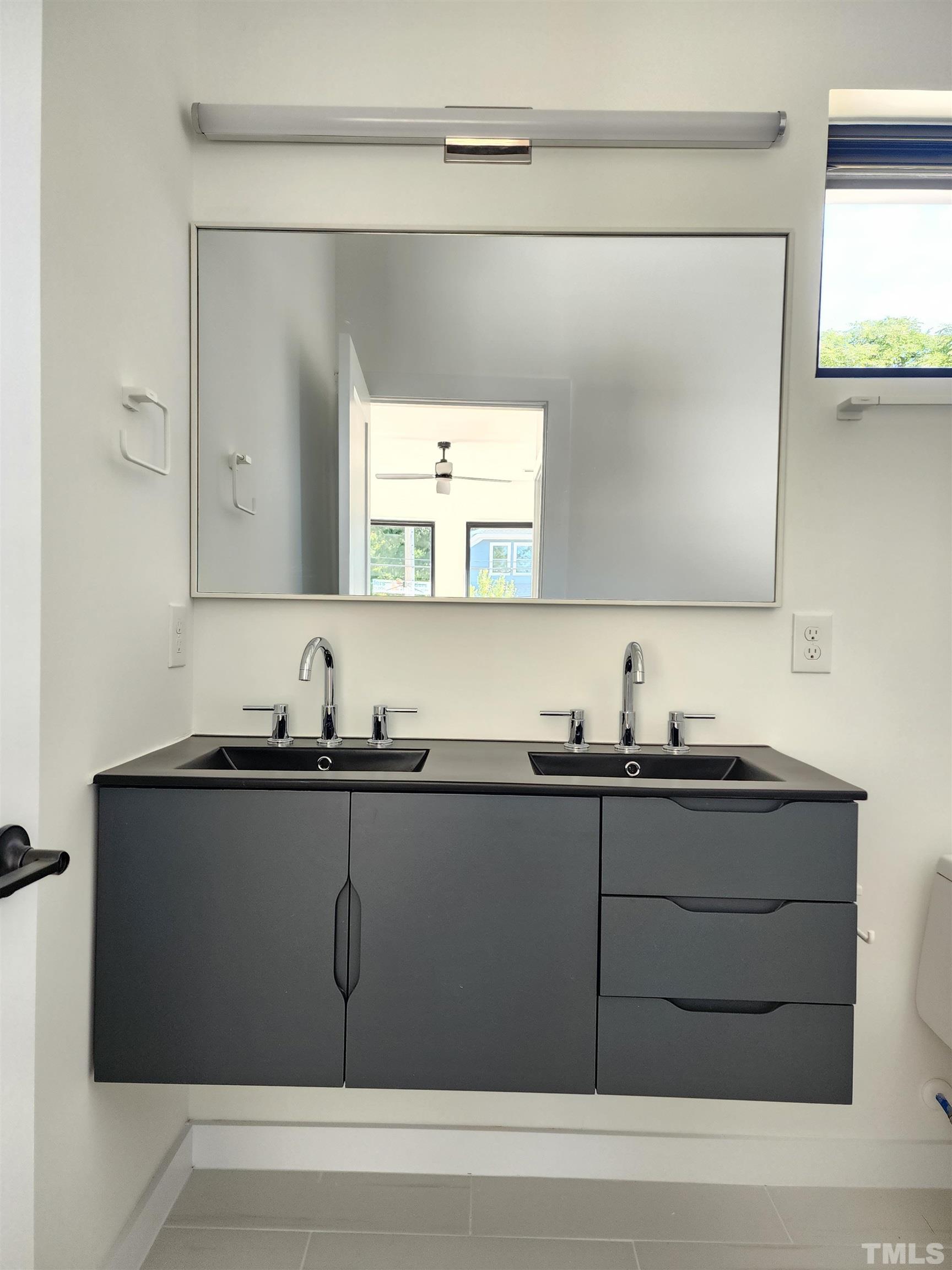 1203 East Lane Street Raleigh, NC 27601 - Photo 20 of 24 a kitchen with a sink and cabinets