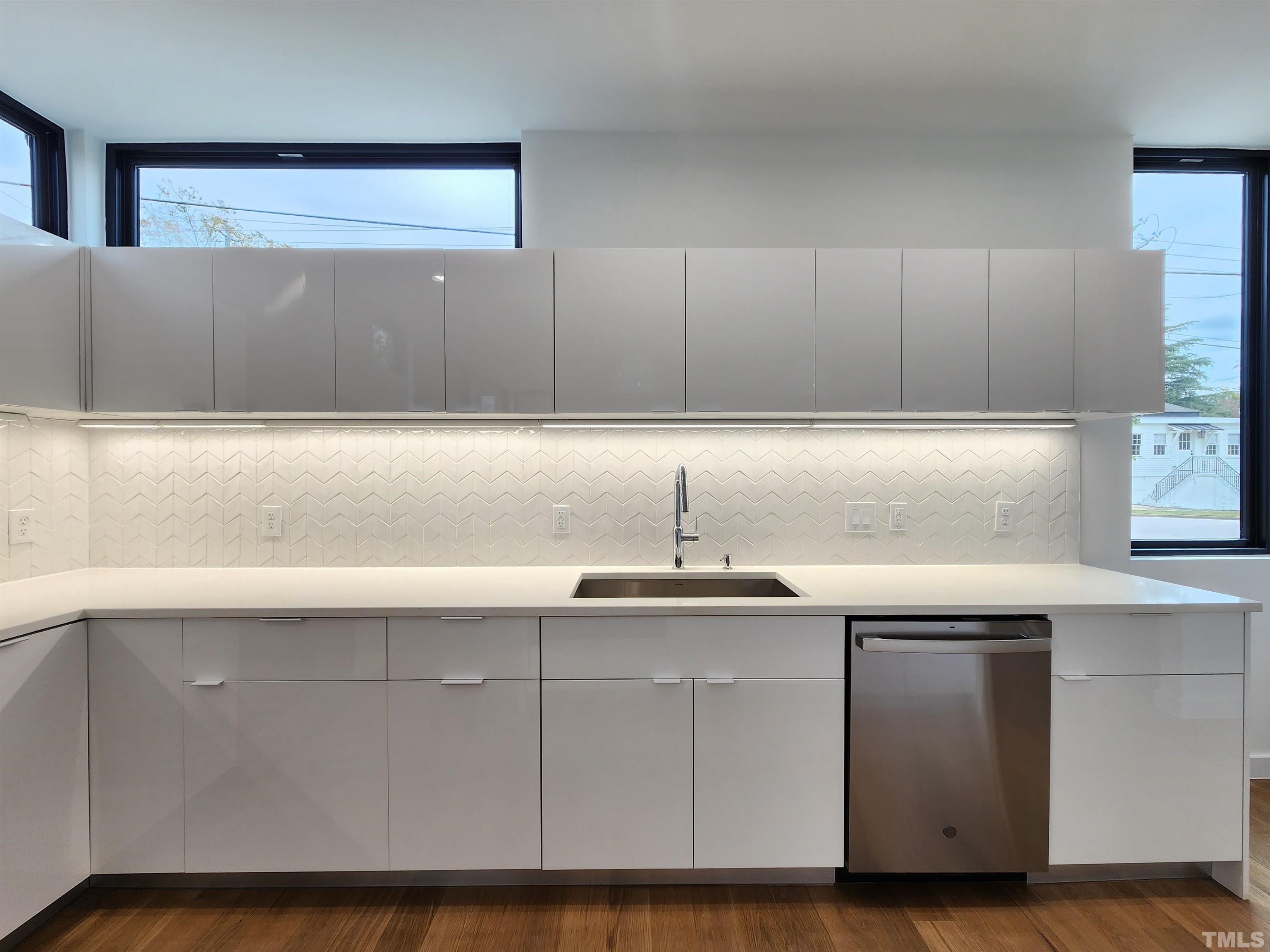 1203 East Lane Street Raleigh, NC 27601 - Photo 5 of 24 a kitchen with a sink and cabinets