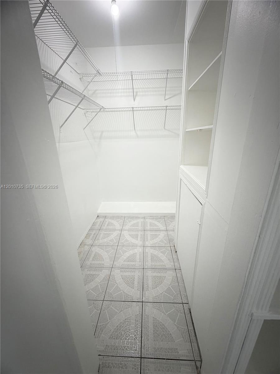 2736 Southwest 22nd Avenue, Unit 2 Miami, FL 33133 - Photo 12 of 12 a view of a room with white door