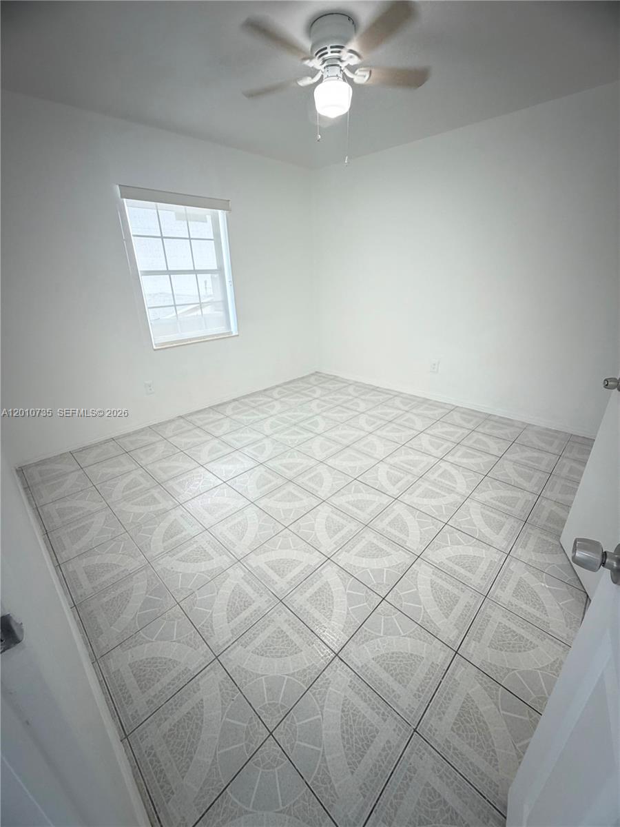2736 Southwest 22nd Avenue, Unit 2 Miami, FL 33133 - Photo 8 of 12 en empty room with windows