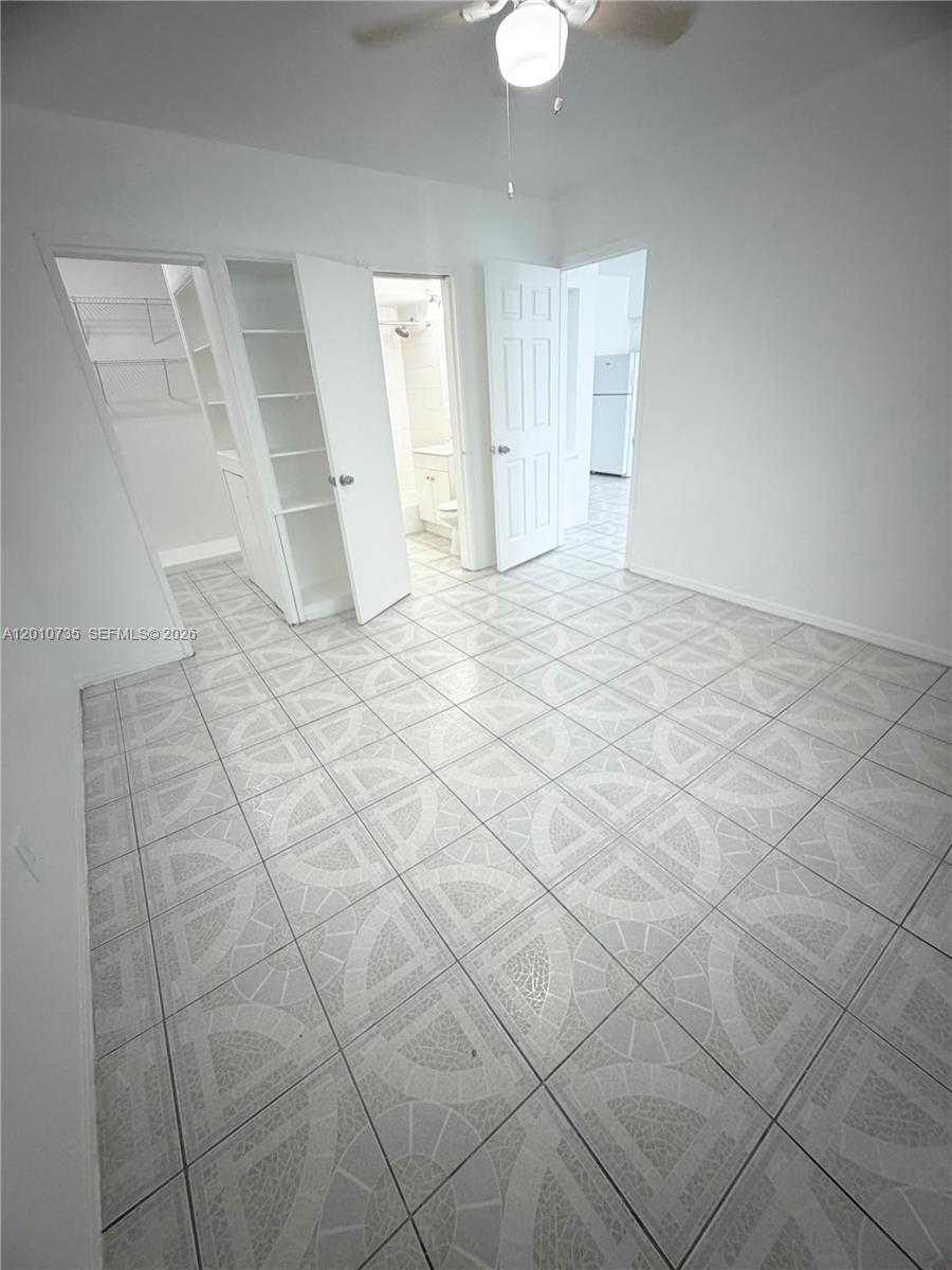 2736 Southwest 22nd Avenue, Unit 2 Miami, FL 33133 - Photo 9 of 12 en empty room with white walls and tiles