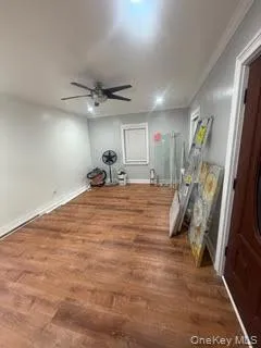 a room with furniture and a ceiling fan